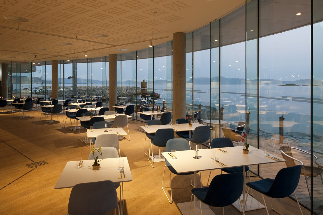 Oseana restaurant featuring ERCO LED lighting with a sea view in Os, Norway.