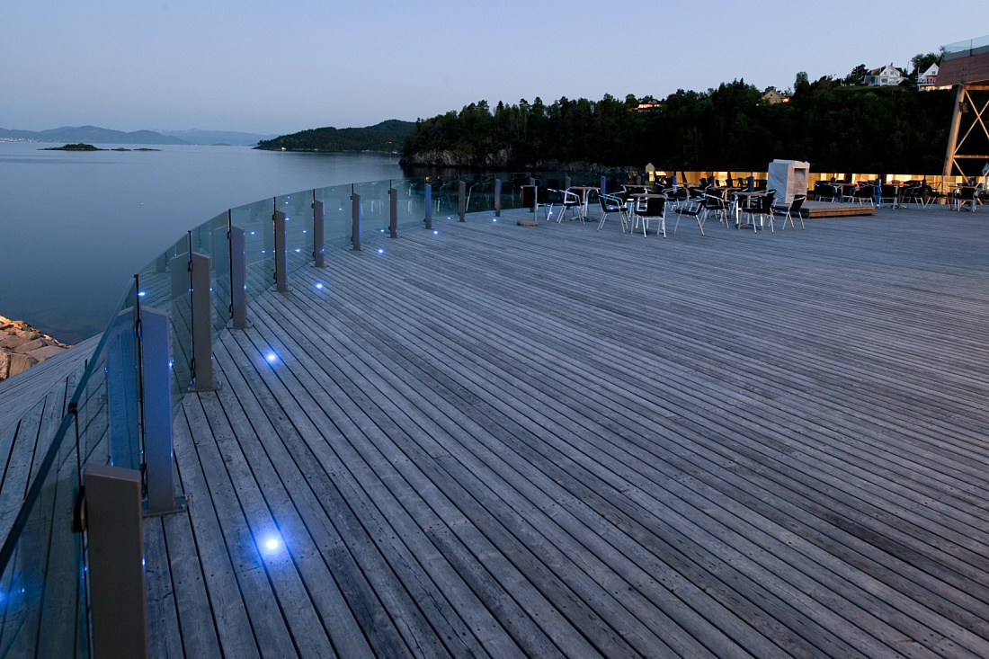 Oseana cultural center terrace with ERCO LED lighting at dusk.