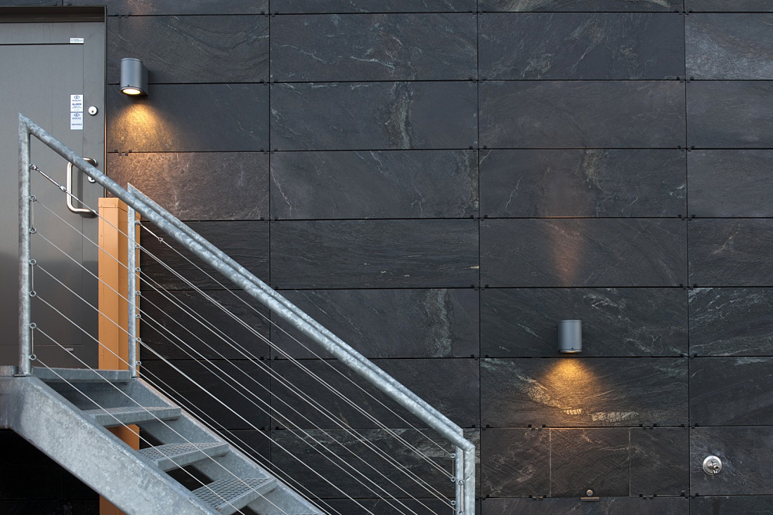 Exterior wall lighting with ERCO LED luminaires on a building with stairs.