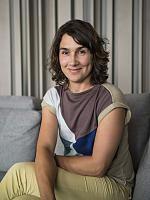 Portrait of a woman in an Otto Wulff showroom, illuminated with ERCO lighting.