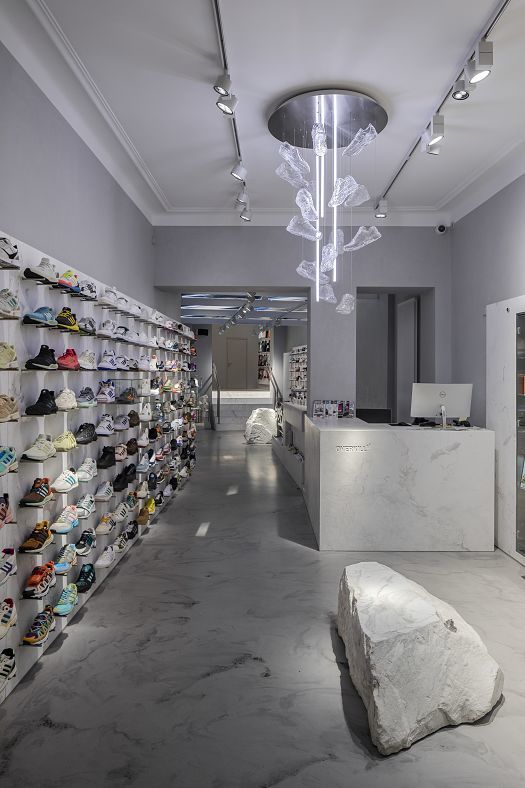 ERCO lighting at Overkill store in Cologne: sneakers and art radiantly displayed with wallwashing and accent lighting.