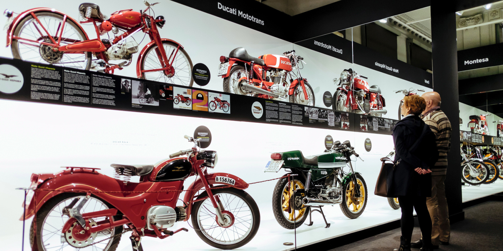 Motorcycle exhibition at Palau Robert, Barcelona, illuminated by ERCO spotlights for flexible lighting concepts.