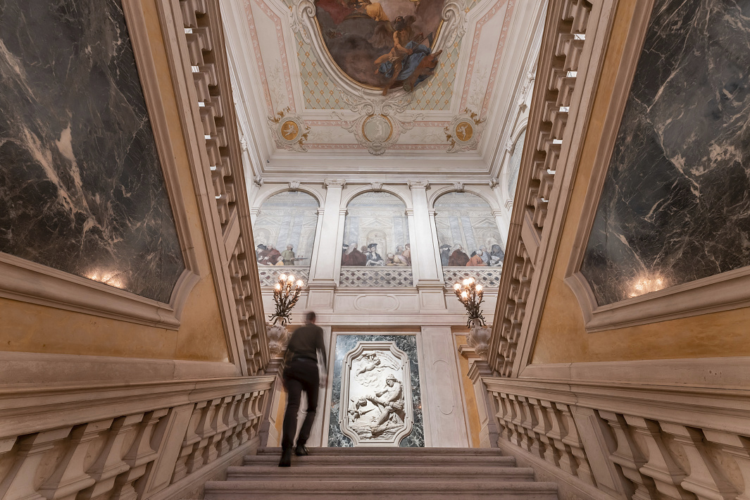 Palazzo Grassi staircase in Venice, illuminated with ERCO LED spotlights for energy efficiency and flexibility.