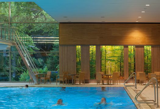 Parkbad Volksdorf swimming pool featuring ERCO Compact downlights for glare-free light and color rendering.