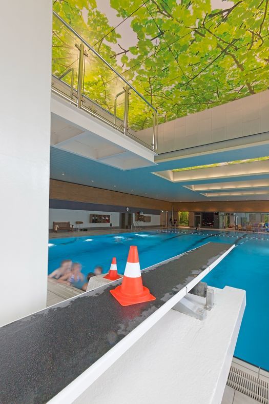 Parkbad Volksdorf swimming pool with ERCO lighting and diving board.