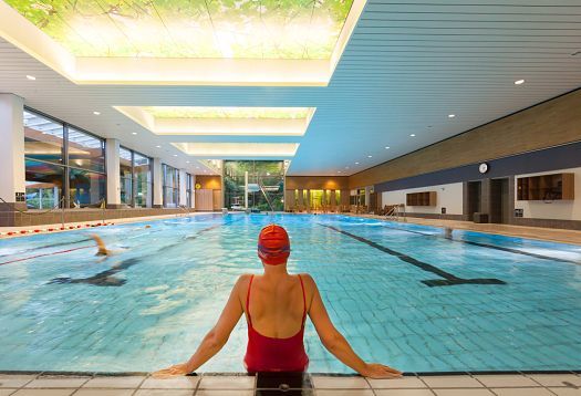 Parkbad Volksdorf swimming pool featuring ERCO Compact downlights for glare-free light.