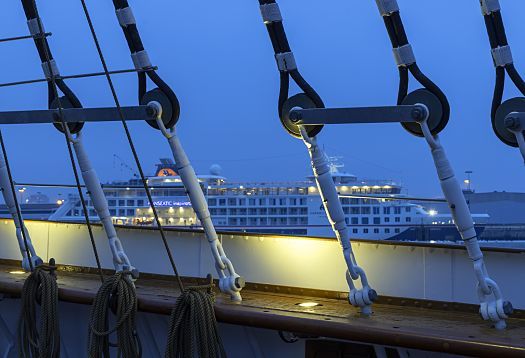 Rigging of the Peking sailing ship, illuminated by ERCO lighting at night.