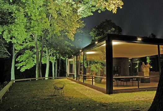 The Glass House by Philip Johnson, illuminated with ERCO lighting for spatial depth and ambiance.