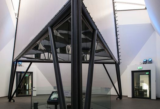Interior view of Phänomenta Science Center in Lüdenscheid, featuring a steel structure and lighting.