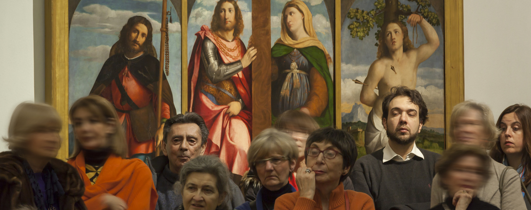 Visitors viewing paintings at Pinacoteca di Brera, illuminated by ERCO LED spotlights.