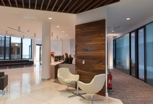 Reception area of Pinsent Masons law firm in Belfast, featuring ERCO lighting.