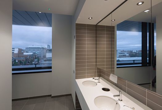 Pinsent Masons Belfast office bathroom featuring ERCO lighting for optimal illumination.