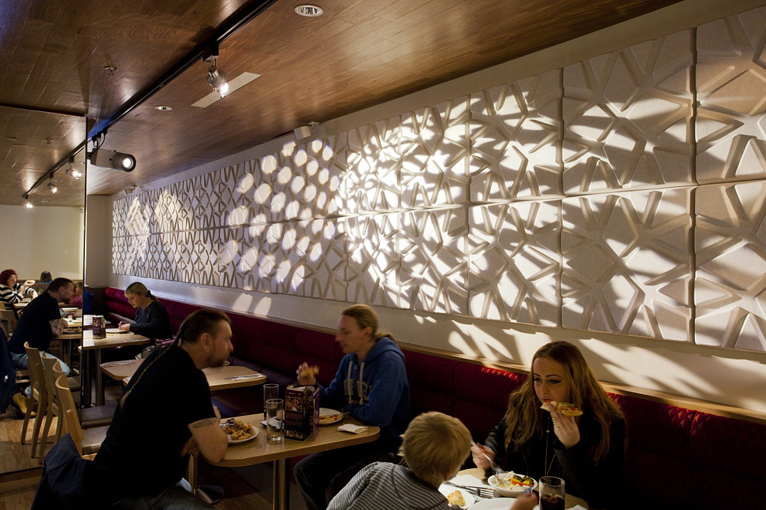 Pizza Hut restaurant interior featuring ERCO LED spotlights and diners at Mill Lane Arcade.