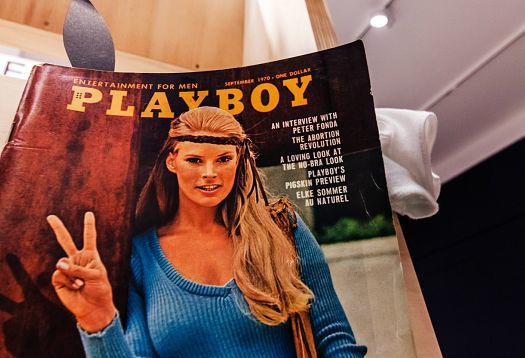 1970 Playboy magazine cover at architecture exhibit, illuminated by ERCO lighting.
