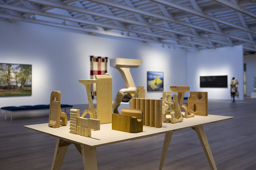 Wooden sculptures on display at Polygon Gallery, illuminated by ERCO LED spotlights.