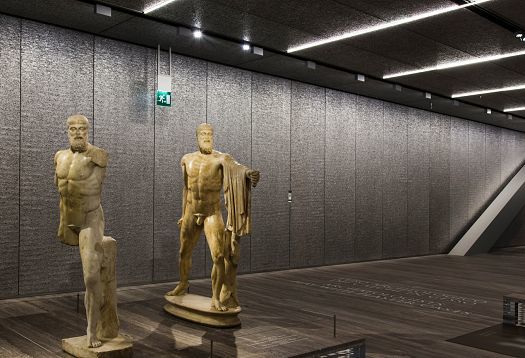 ERCO LED lighting at Fondazione Prada, Milan, showcasing ancient sculptures under neutral white light.