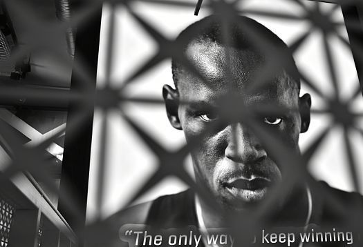 Usain Bolt portrait in PUMA store, accented with ERCO LED lighting.