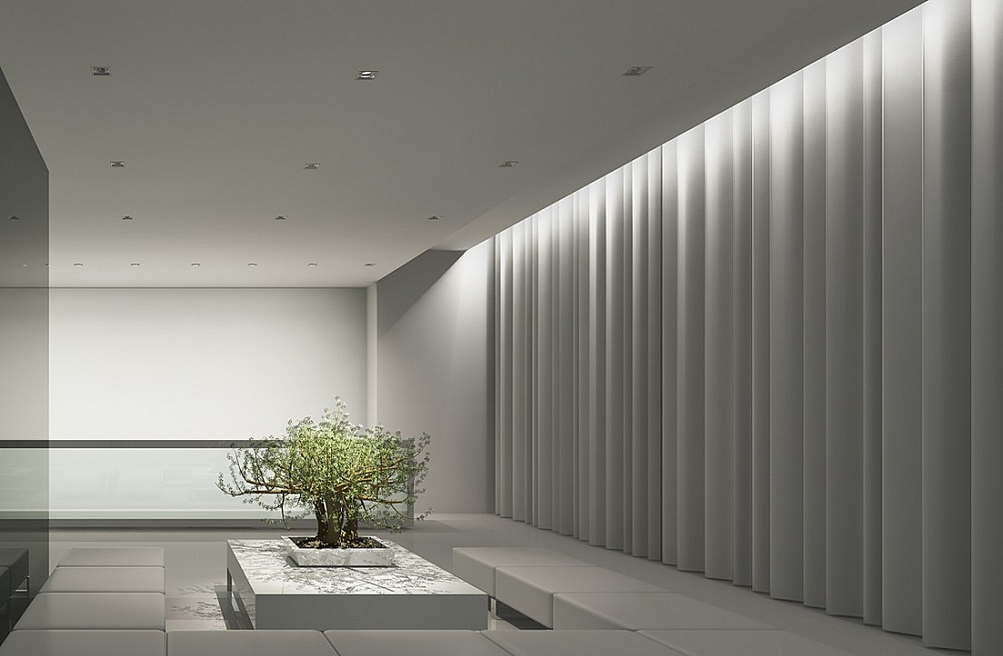 Illuminated space with ERCO recessed ceiling luminaires and textile wall for soft, diffused light.