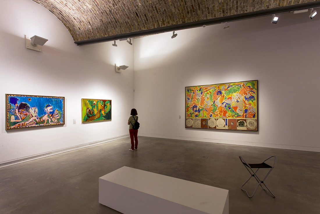 Ravensburg Art Museum interior featuring LED lighting and visitors viewing paintings.