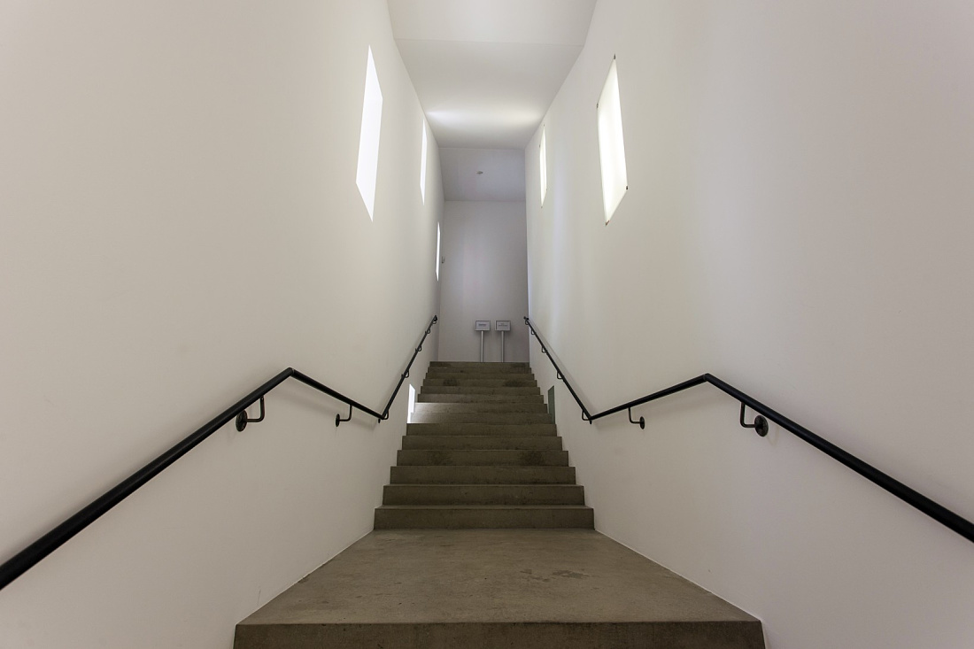 Stairwell in Ravensburg Art Museum, naturally lit by windows.