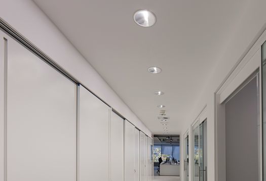 ERCO Compact recessed ceiling lights in an Engel & Völkers office for efficient office lighting.