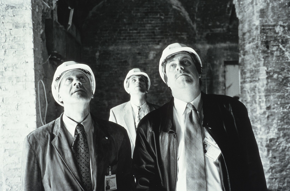 Architects in hard hats inspect lighting at the Reichstag Building, an ERCO project.