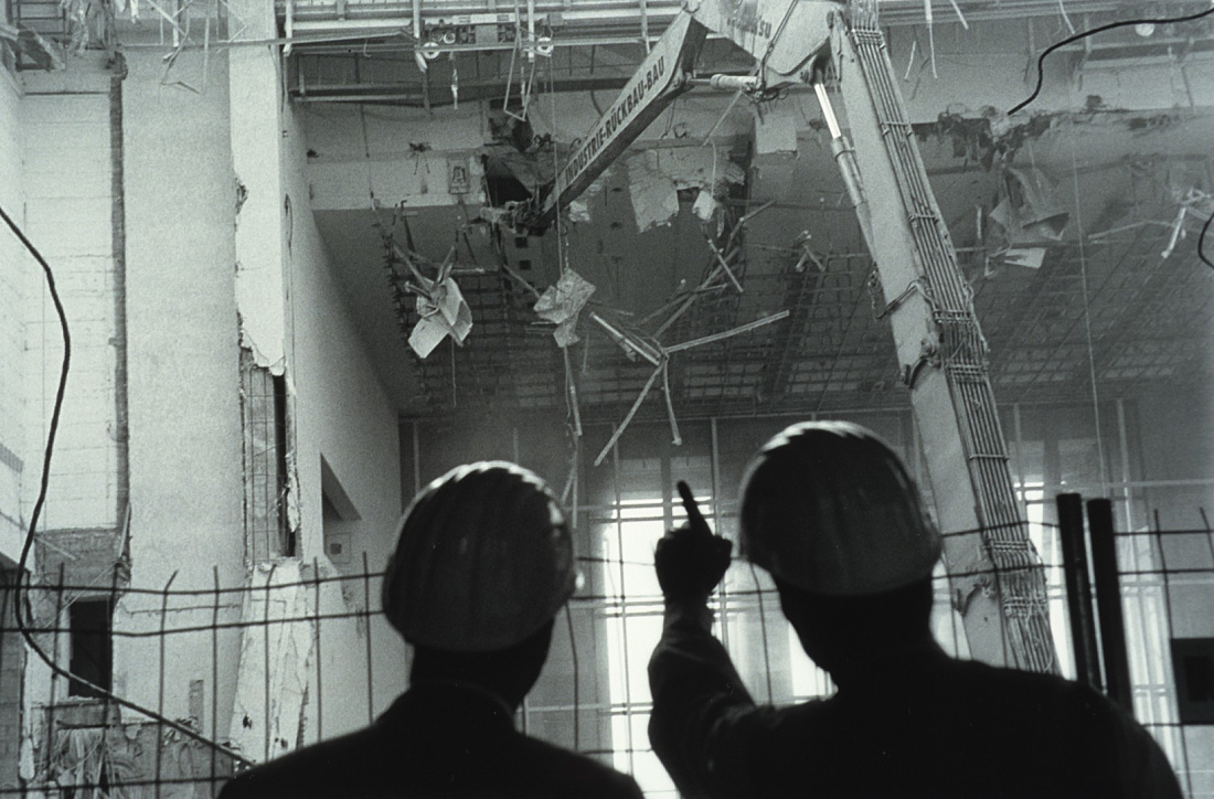 Construction workers observe demolition at the Reichstag Building, an ERCO project.
