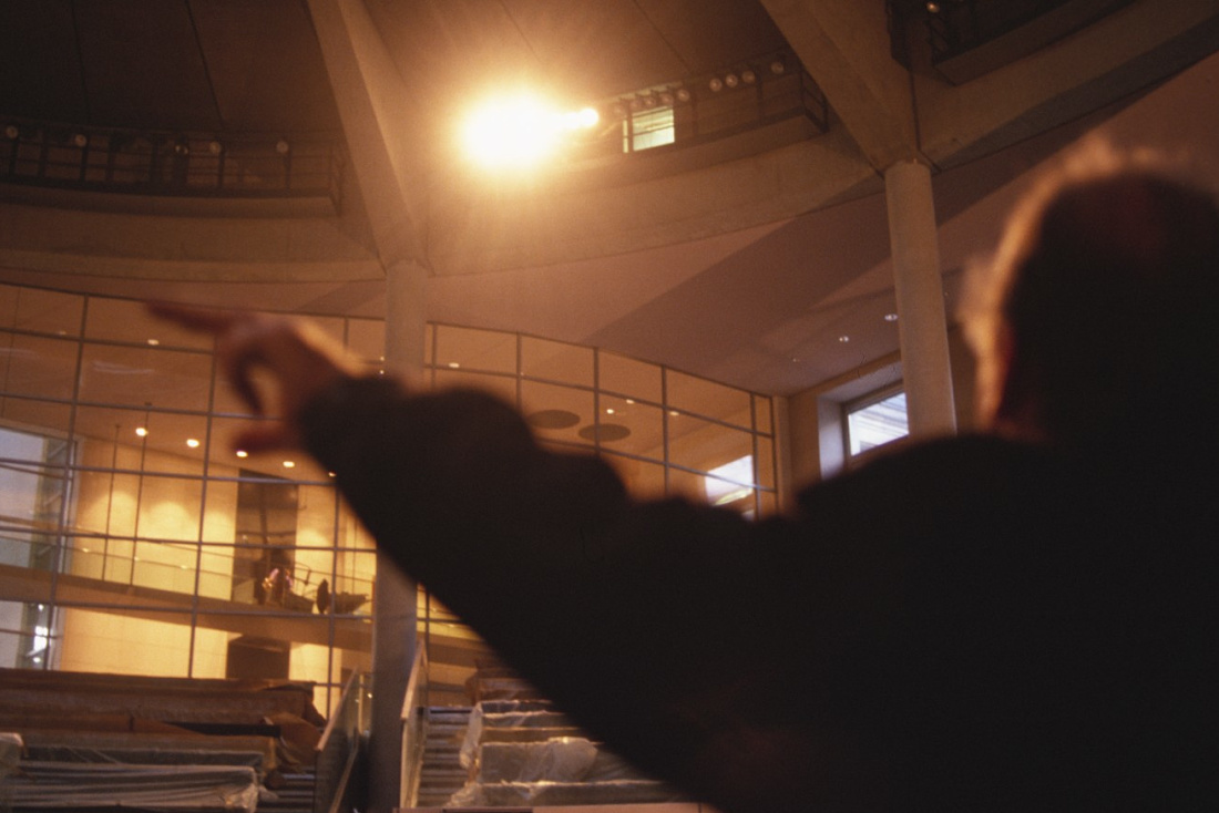 Interior view of the Reichstag Building, showcasing lighting that highlights architectural details.