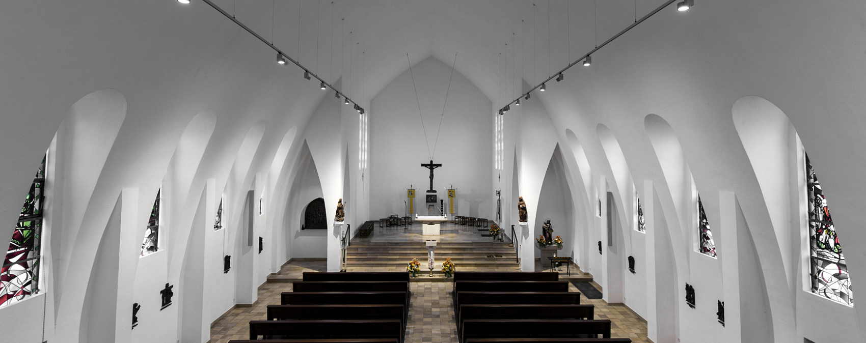 Interior of St. Mary's Birth Church featuring ERCO spotlights on track lighting the space.