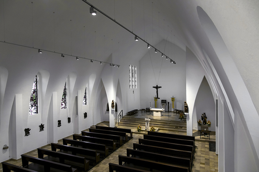 Interior of St. Mary's Birth Church featuring ERCO spotlights on track lighting the space.