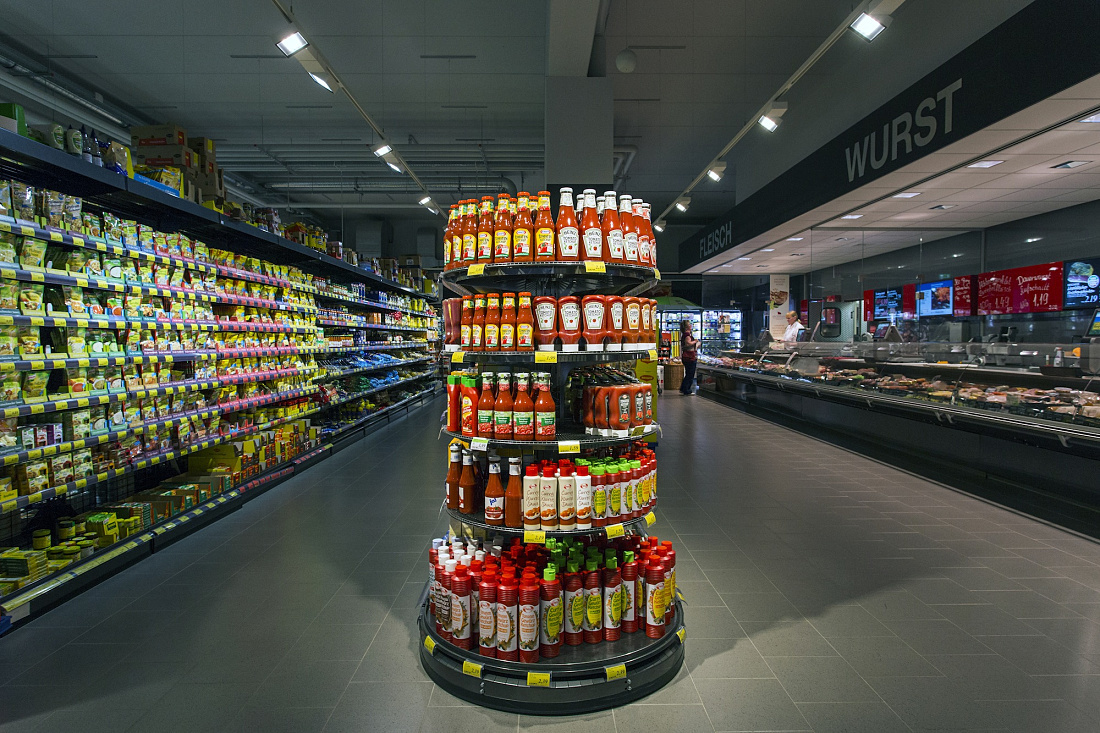 REWE supermarket in Hagen-Hohenlimburg featuring Opton LED accent lighting for energy efficiency.