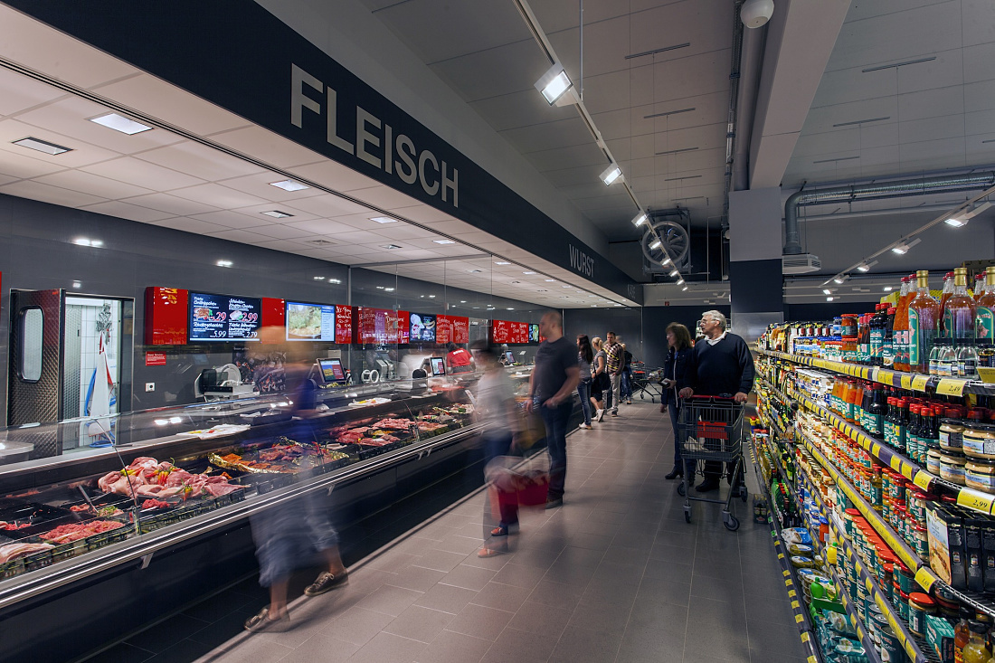 REWE supermarket in Hohenlimburg featuring Opton LED accent lighting for meat and sausages.