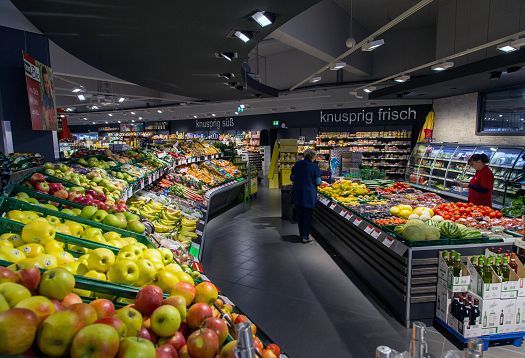 REWE supermarket in Hagen-Hohenlimburg featuring ERCO LED accent lighting for fresh produce.