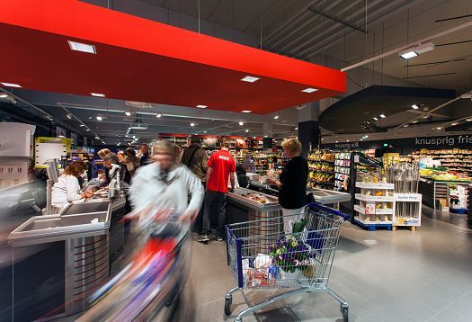 REWE supermarket in Hagen-Hohenlimburg featuring ERCO LED accent lighting for product presentation.