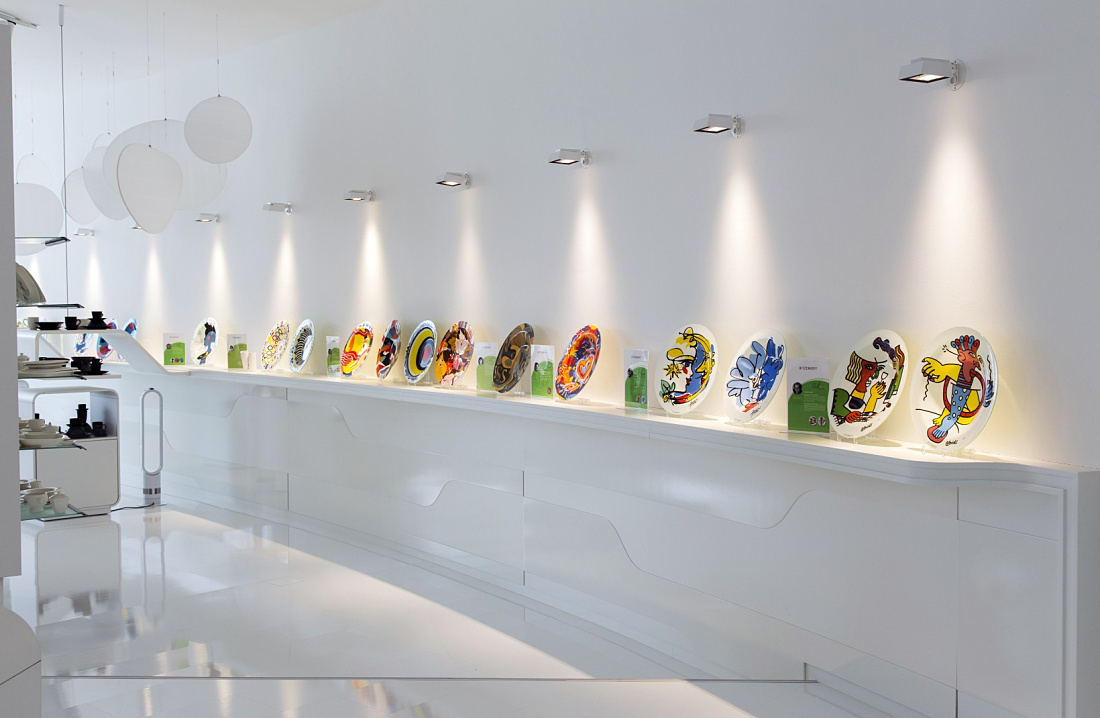 Ritzenhoff glass factory exhibit illuminated by ERCO Light Board spotlights for accent lighting.
