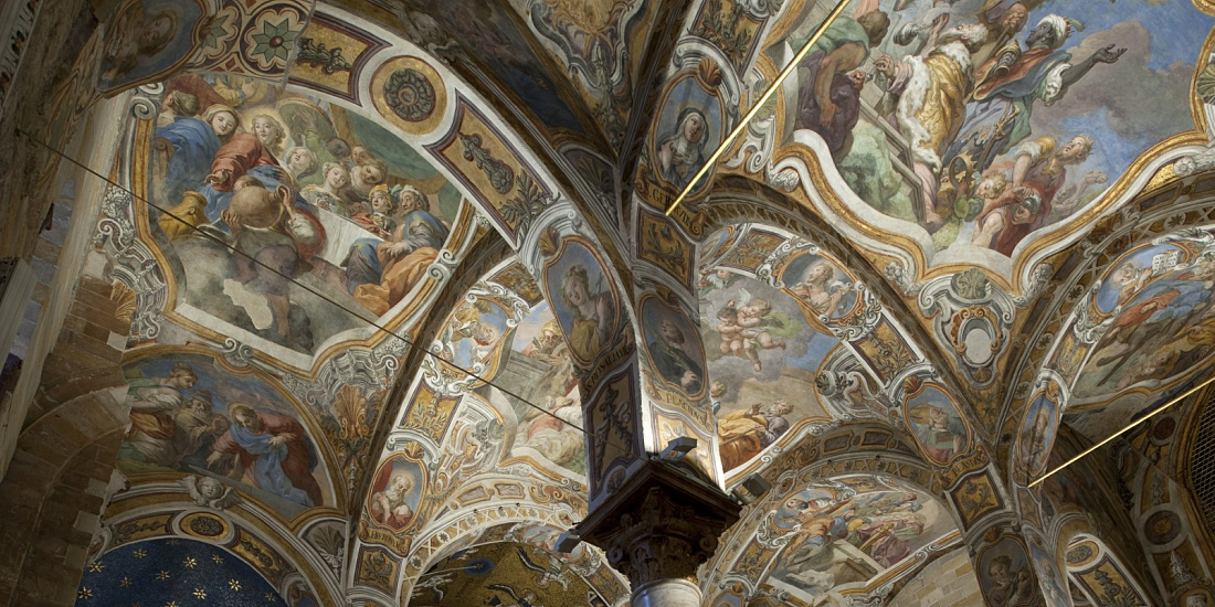 Ornate ceiling frescoes in Santa Maria dell’Ammiraglio church, Palermo, illuminated by ERCO LED lighting.