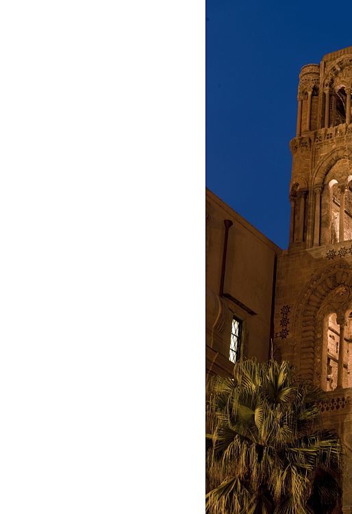 Illuminated bell tower of Santa Maria dellAmmiraglio church in Palermo.