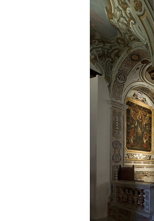 Interior of Santa Maria dell’Ammiraglio church, Palermo, showcasing ornate ceilings and lighting.
