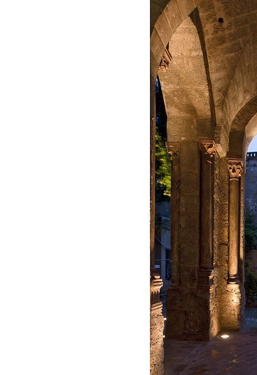 Illuminated arches of Santa Maria dellAmmiraglio church in Palermo, showcasing architectural lighting.