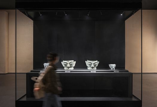 Sanxingdui Museum display case featuring illuminated artifacts with ERCO LED spotlights.