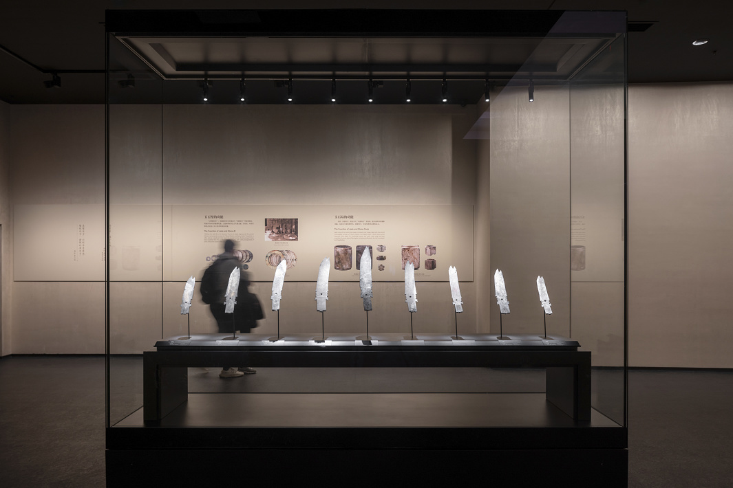 Sanxingdui Museum display case featuring illuminated jade artifacts with ERCO LED spotlights.