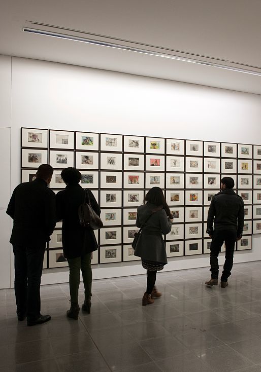 Visitors viewing art at the Serpentine Sackler Gallery, illuminated by ERCO lighting.
