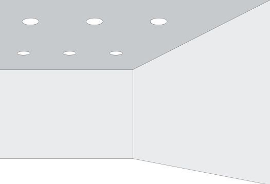 Room with recessed ceiling lights creating light patterns, illustrating laws of shape perception.