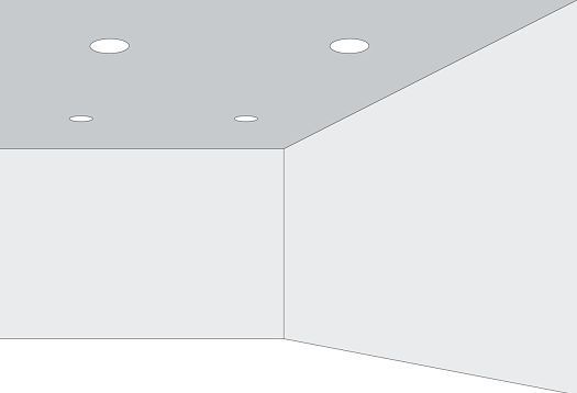 Room with recessed ceiling lights creating light patterns, illustrating shape perception laws.