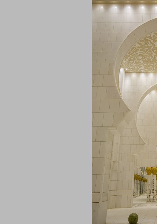 Sheikh Zayed Mosque in Abu Dhabi: Illuminated arches and columns create a sublime atmosphere.