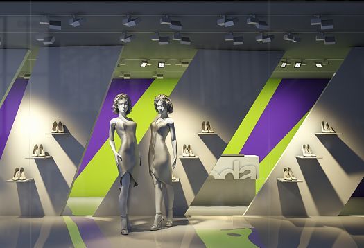 Shop window display illuminated by ERCO lighting, showcasing accent and vertical lighting for product presentation.