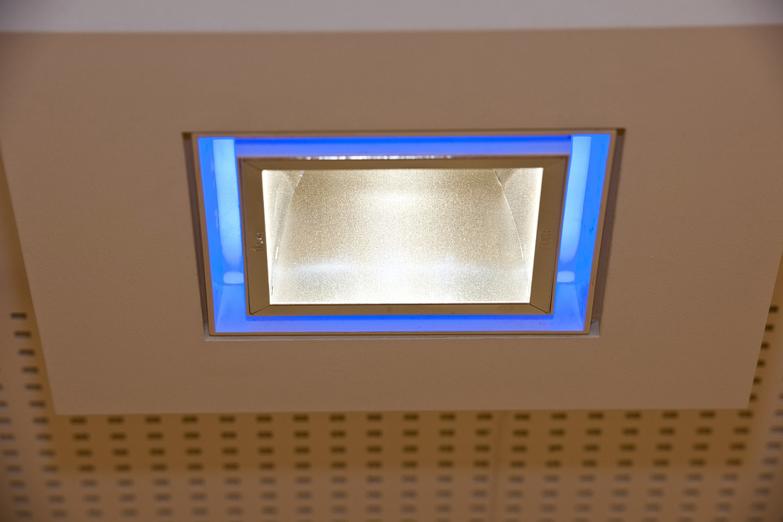 Quintessence recessed luminaire with blue accent lighting in the Sieben Schwaben pharmacy.