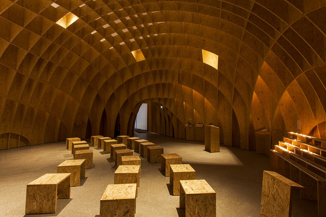 Siegerland Motorway Church interior featuring ERCO lighting, creating a contemplative atmosphere.