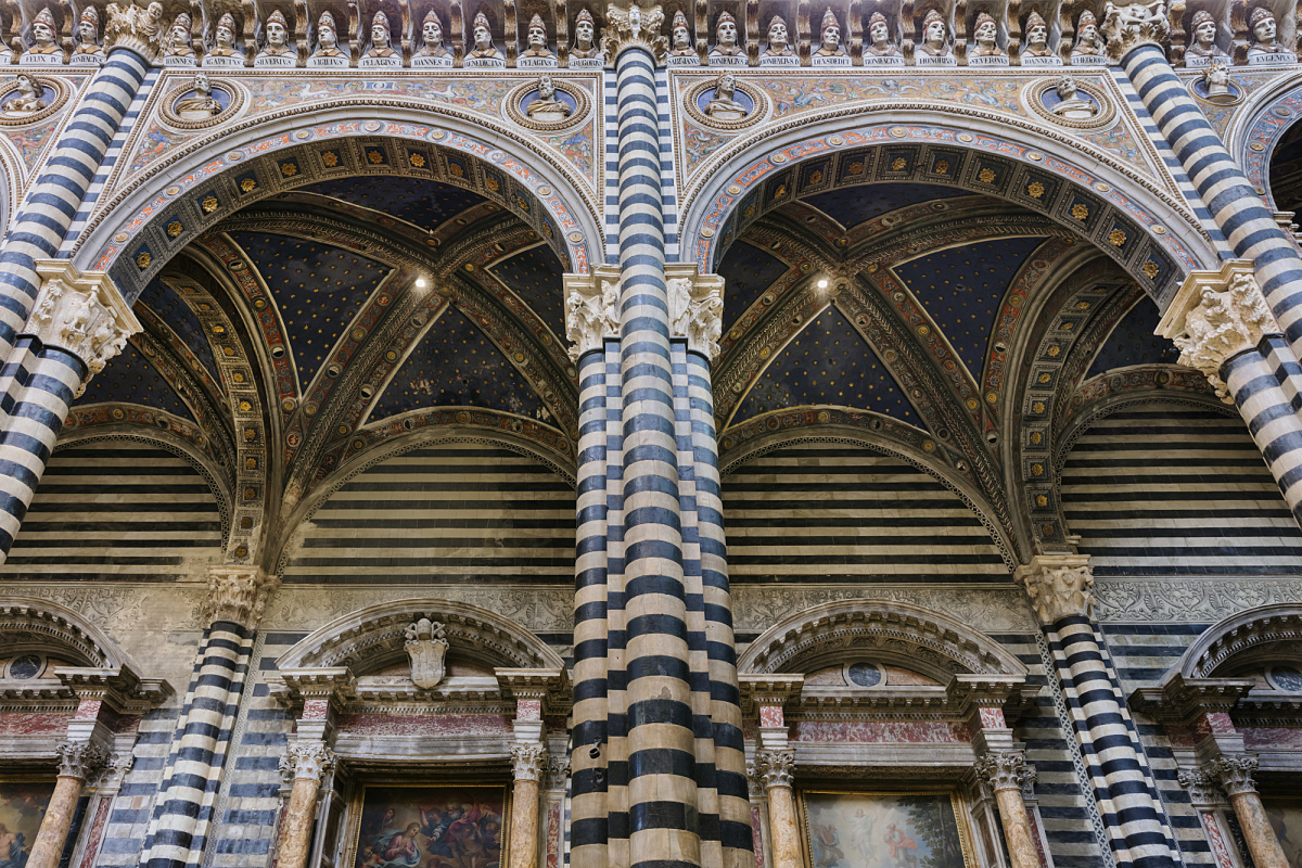 Detailed view of Siena Cathedral's ornate architecture, illuminated by ERCO spotlights.