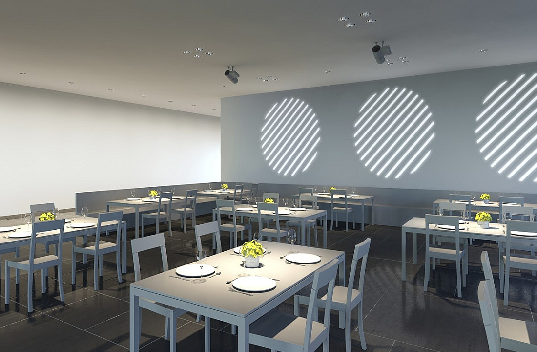 ERCO restaurant lighting with wallwashers and spotlights for ambiance and table accents.